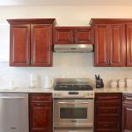 Fully equipped elegant kitchen with solid wood cabinetry, granite counter top and stainless steel appliances.